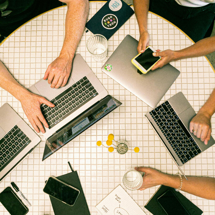 Campaign Execution Team working on a marketing campaign on their laptops
